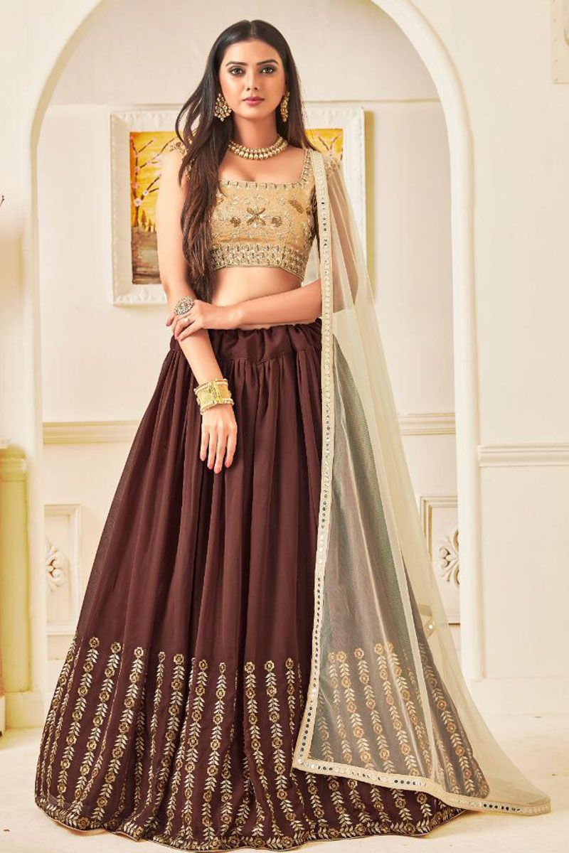 Bridal lehenga paired with brown color heavily embellished choli and two  net dupattas with heavy embroidered border in peach and maroon color  |lovelyweddingmall.com|